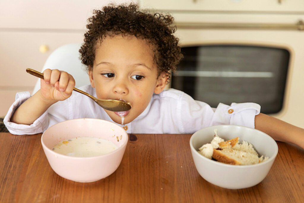 A kid having cereal