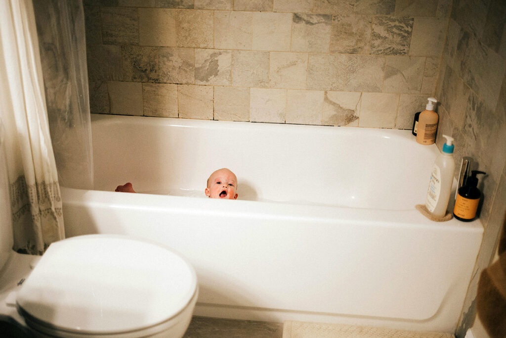 kid taking bath in the bath tub