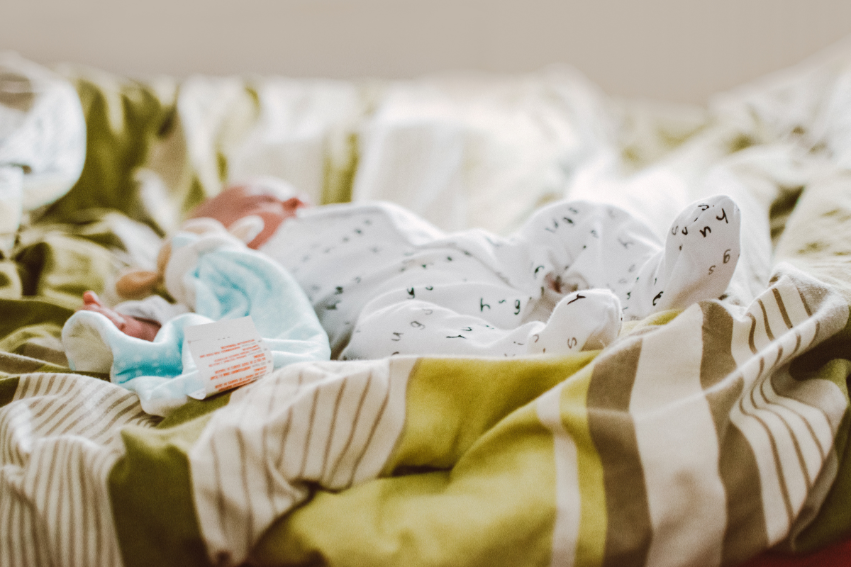 A baby sleeping with a lovey.