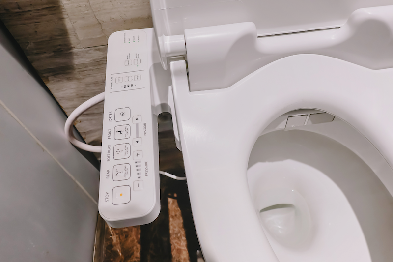 A white bidet with buttons