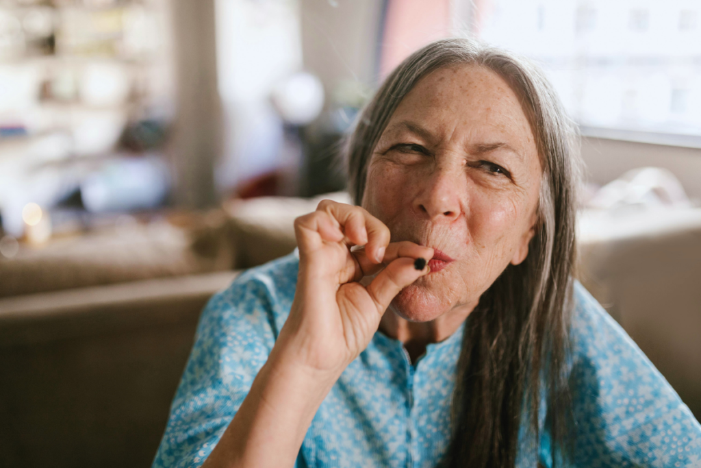 Old person smoking in the living room