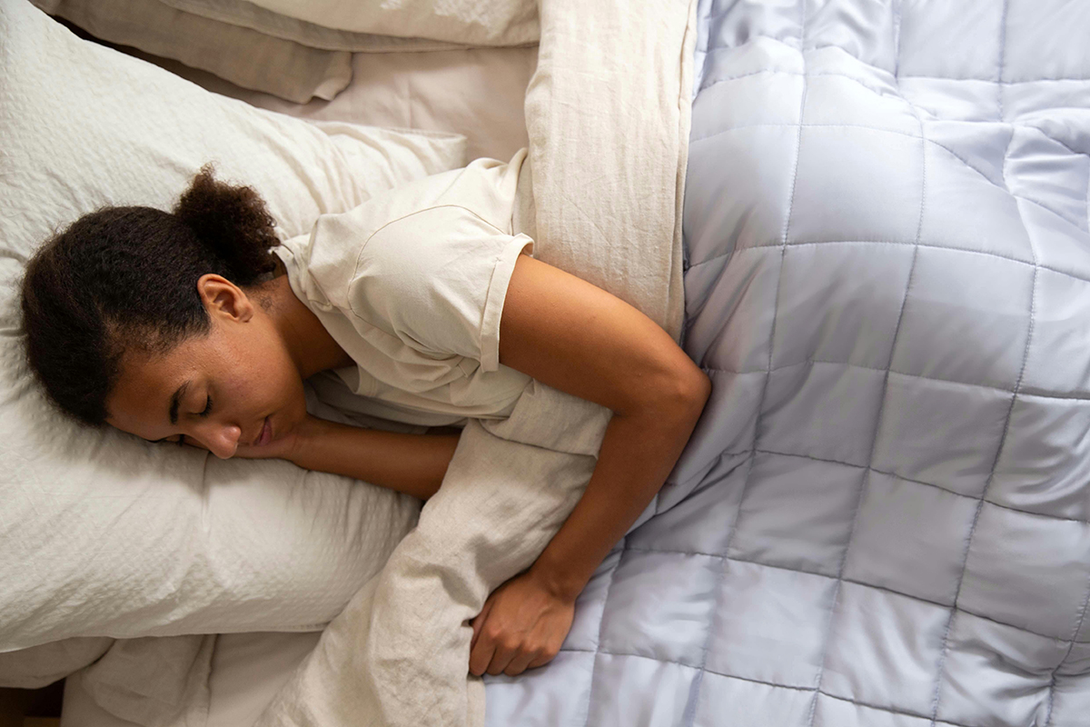 A person sleeping on bed