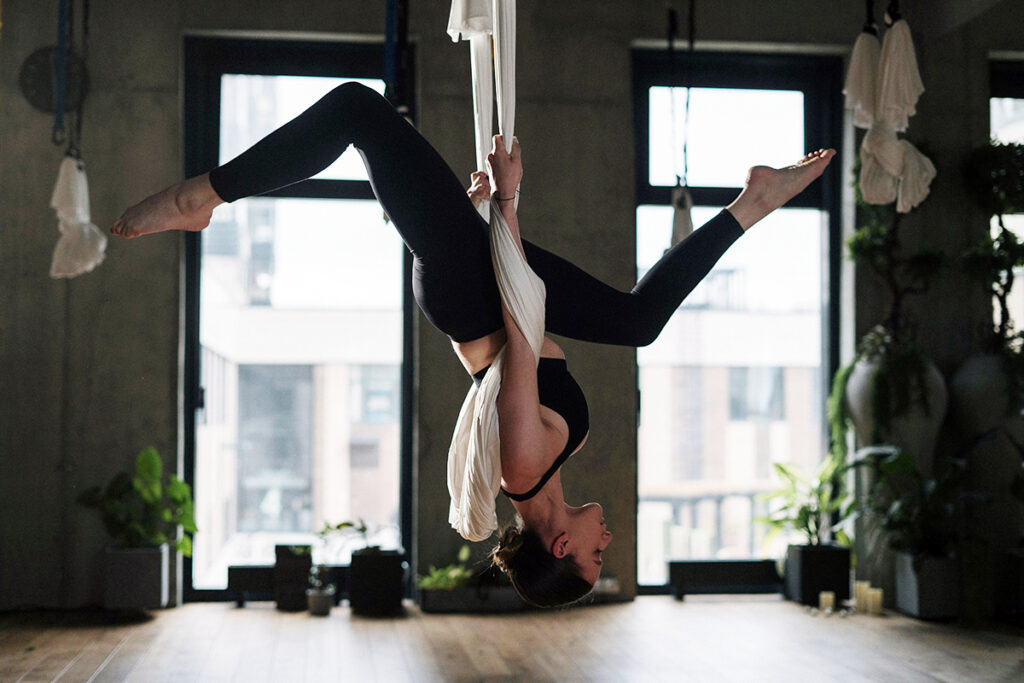 a pregnant adult doing exercise in an upside sown position