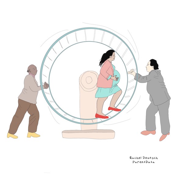 A woman in colorful clothes runs in a hamster wheel that is being stopped from rotating by two men holding it in place.