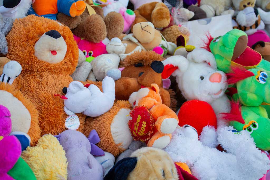 A pile of colorful stuffed toys.