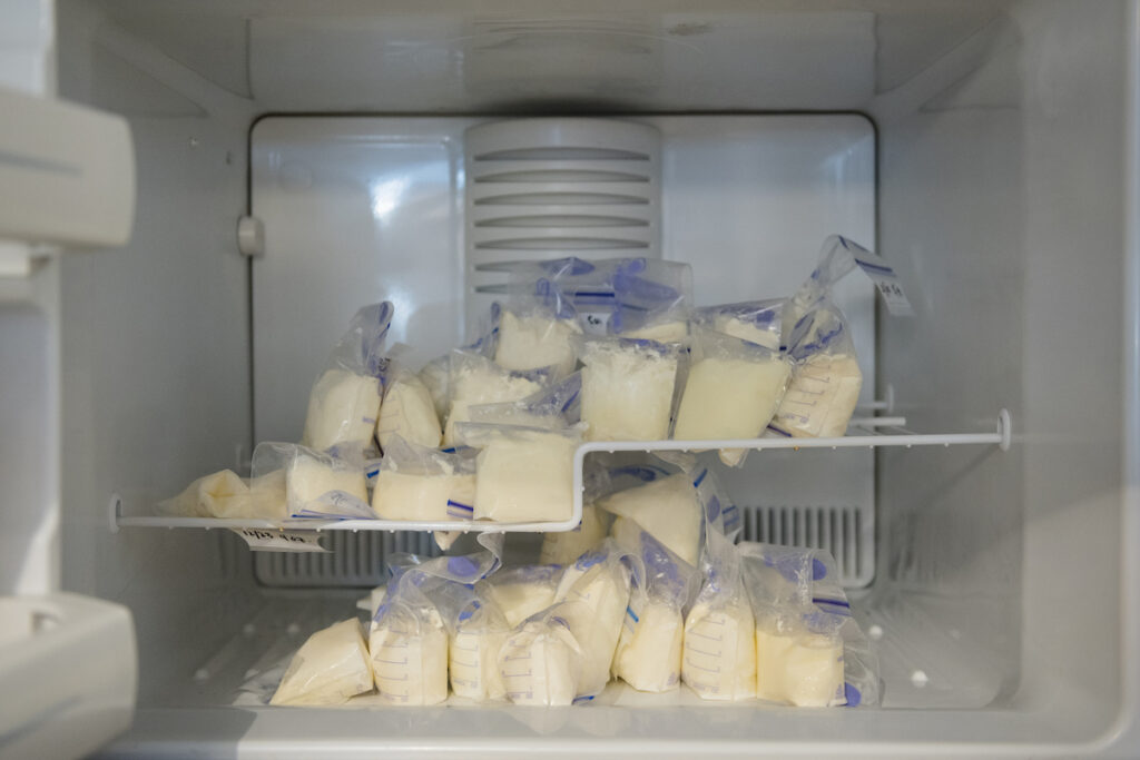 A view inside of a freezer filled with frozen breast milk.