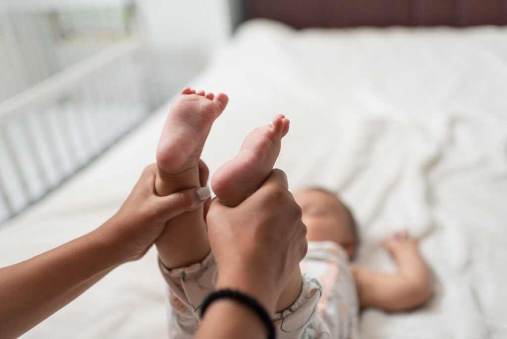 A baby receives chiropractic manipulations.