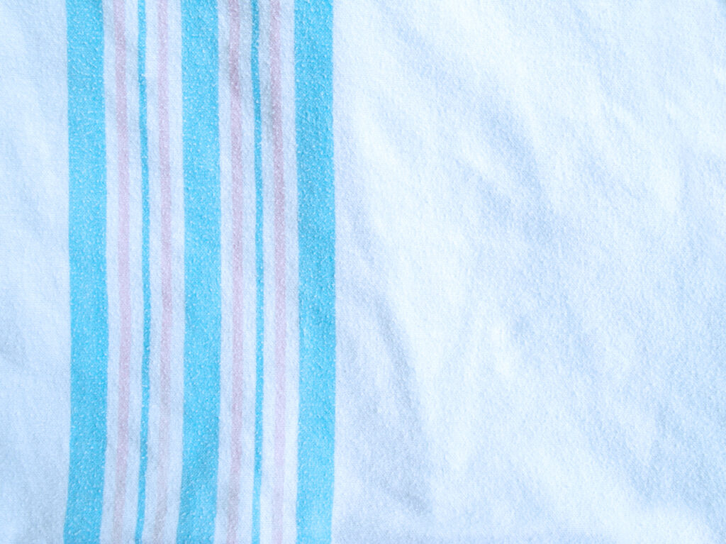 A hospital-style baby blanket stretched out.