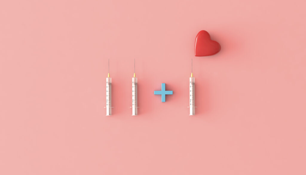 Three syringes are arranged on a pink background with a heart above the third.
