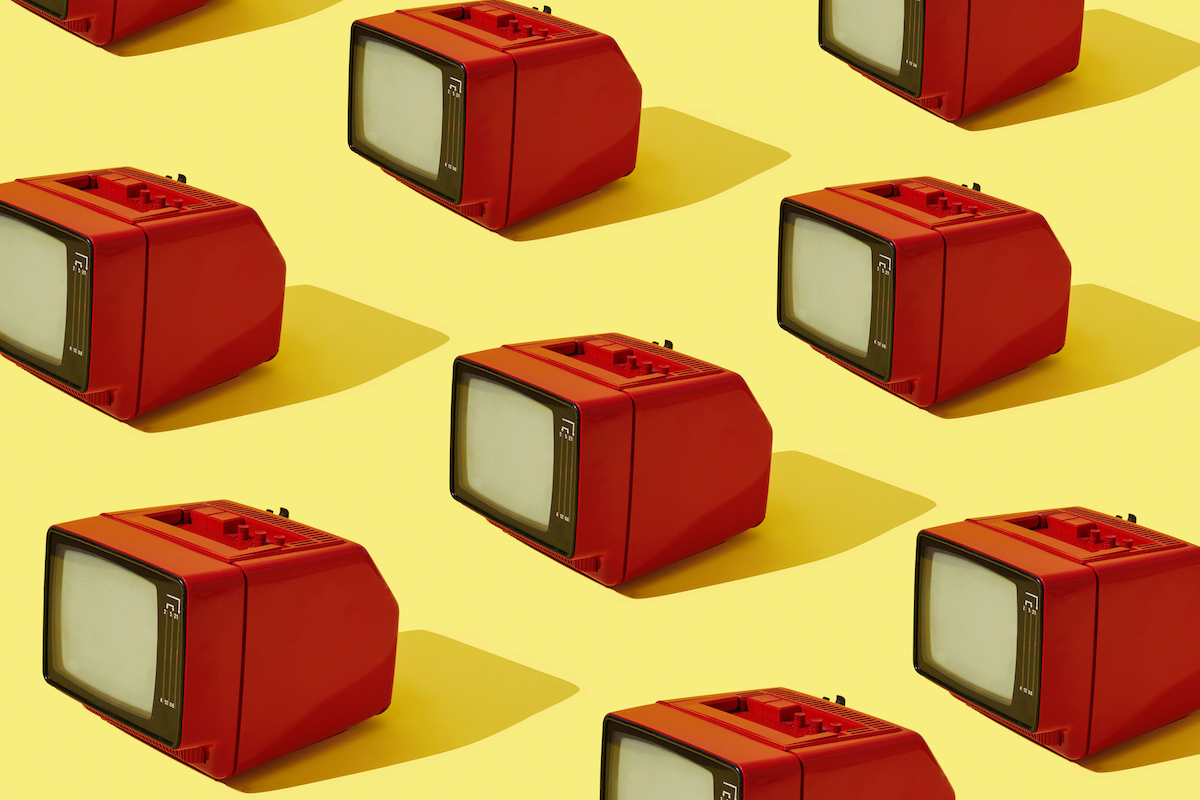Red analog televisions are arranged on a yellow background.