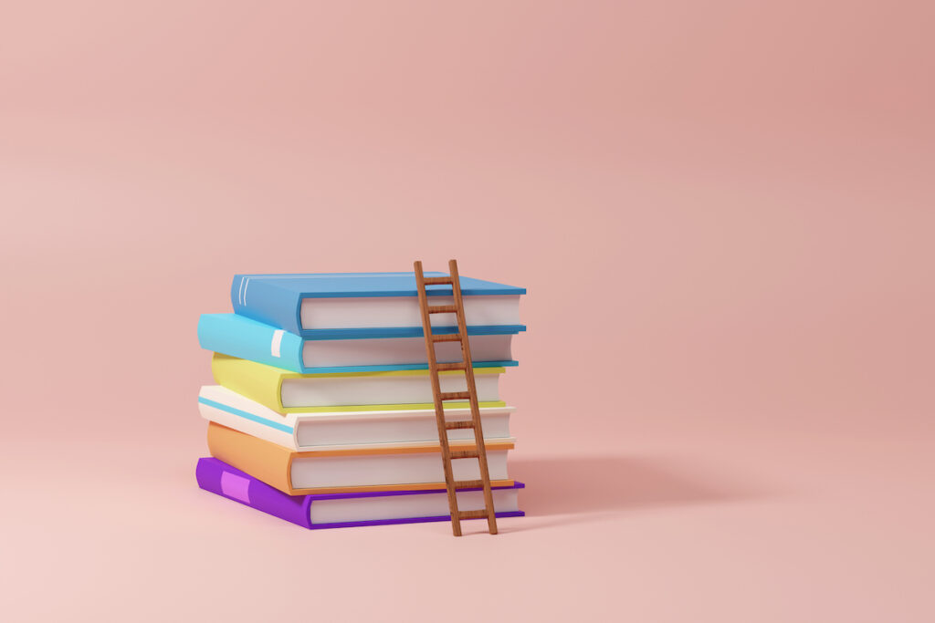 An illustration of a colorful stack of books on a pink background. A small ladder is leaning on the stack.