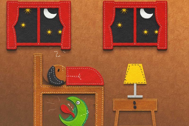 A felt illustration of a child in bed with a green monster under the bed.