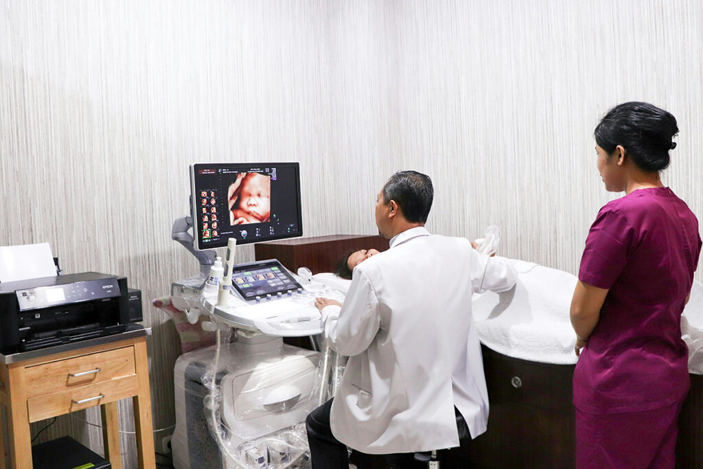 a doctor conducting and ultrasound in the clinic