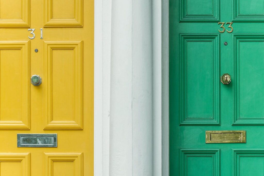 A green door and a yellow door symbolize two options.
