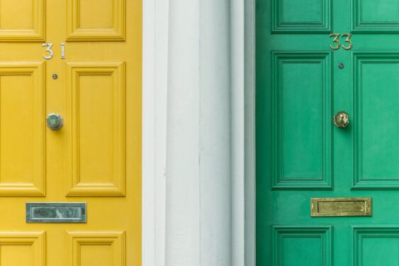A green door and a yellow door symbolize two options.