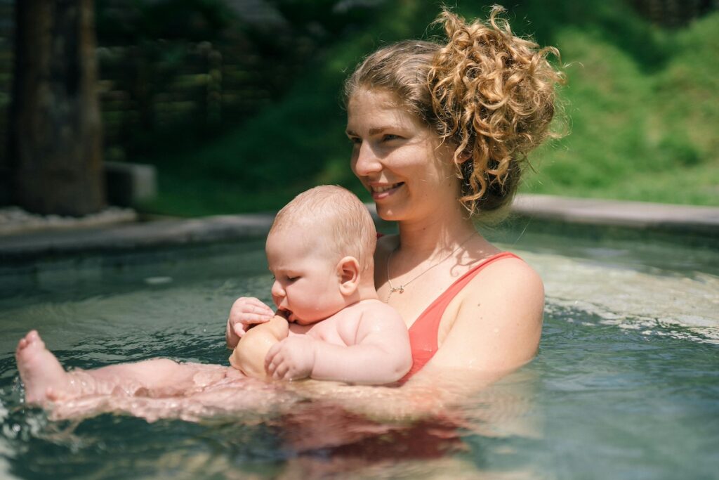 Parent and baby in swimming pool