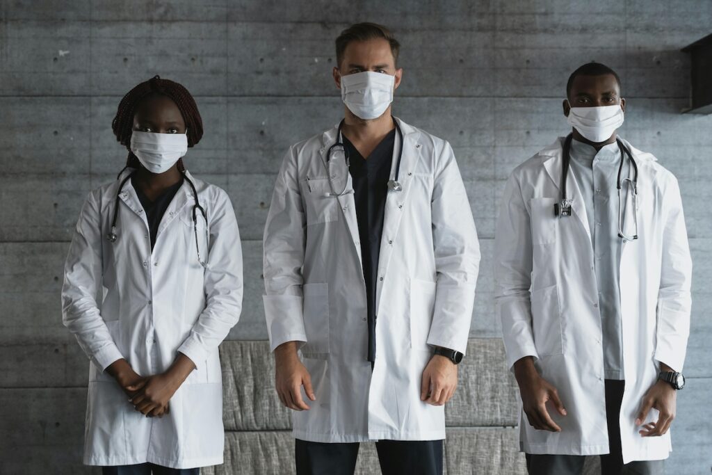 Three doctors in white coats