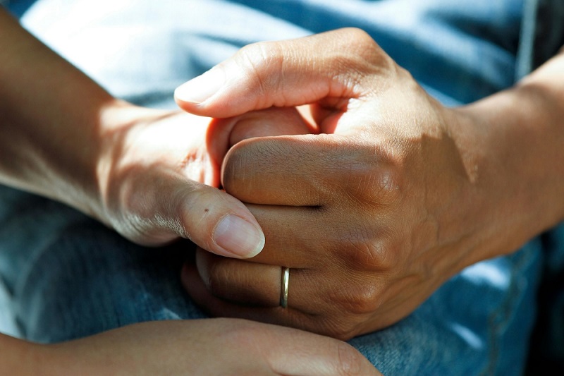 midwife holding hand of a mother