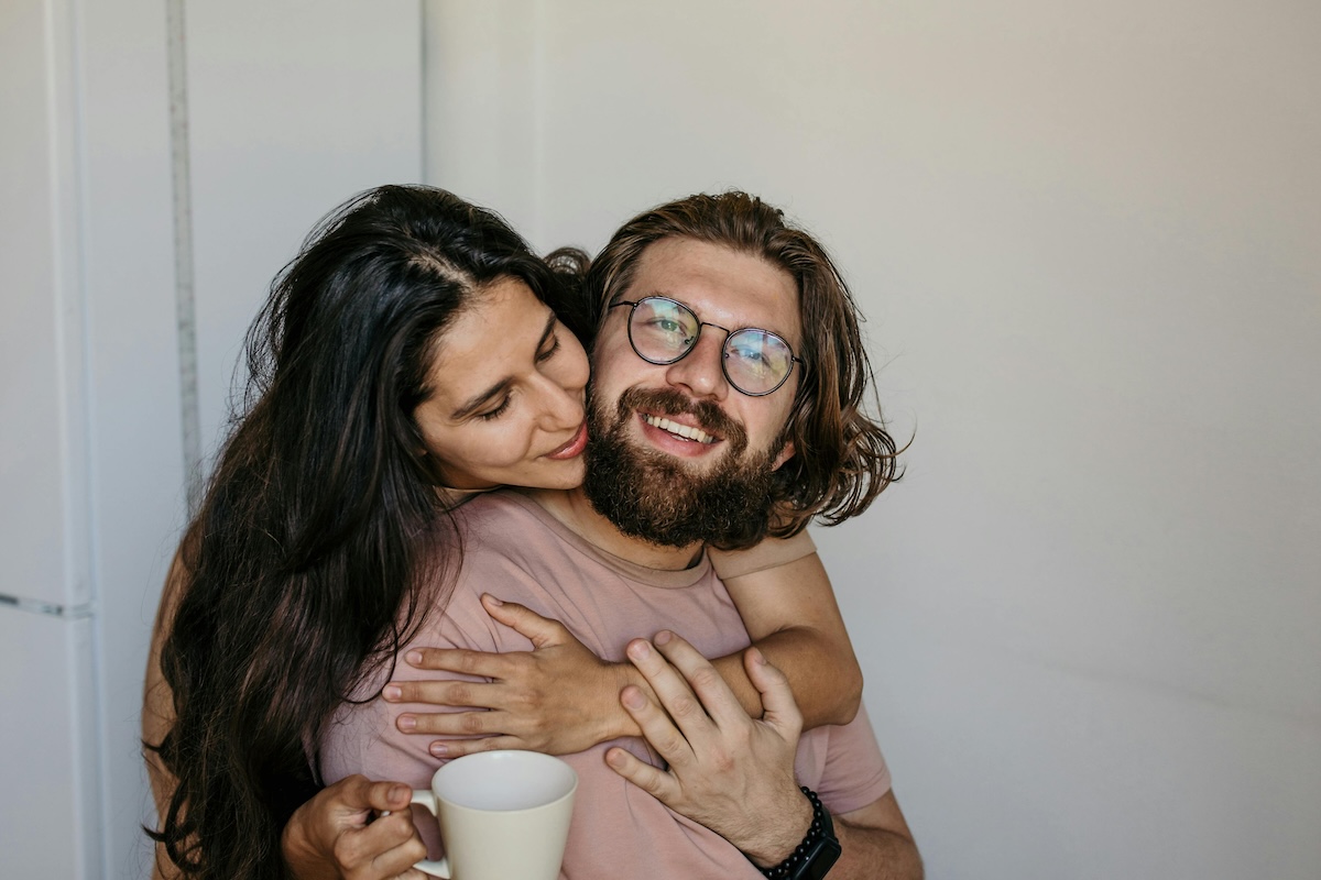 Two people in a relationship embracing