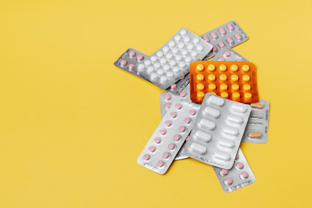 multiple tablets packed and placed on a yellow background