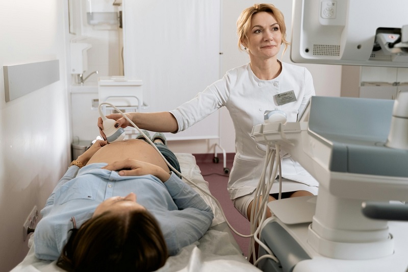 A doctor checking a patient in a hospital