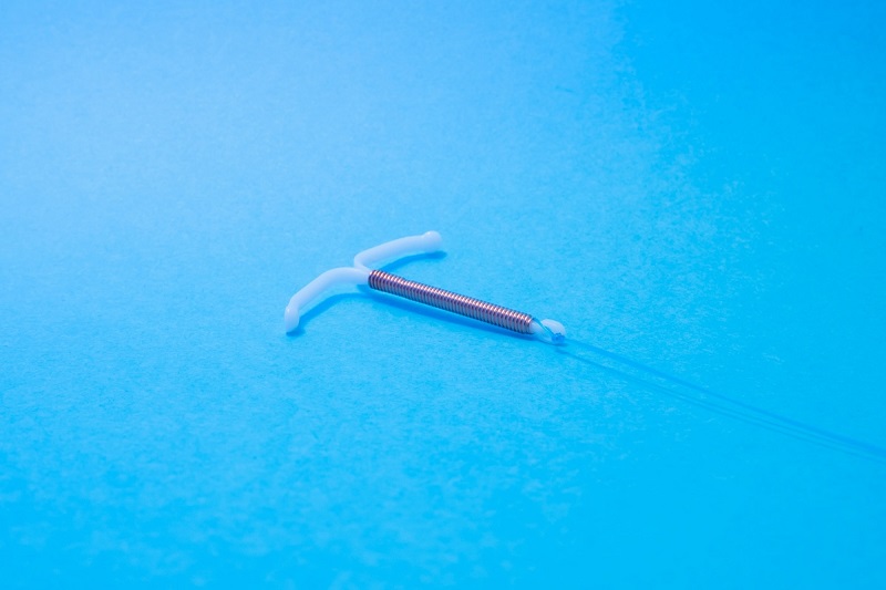 contraceptive device with blue background