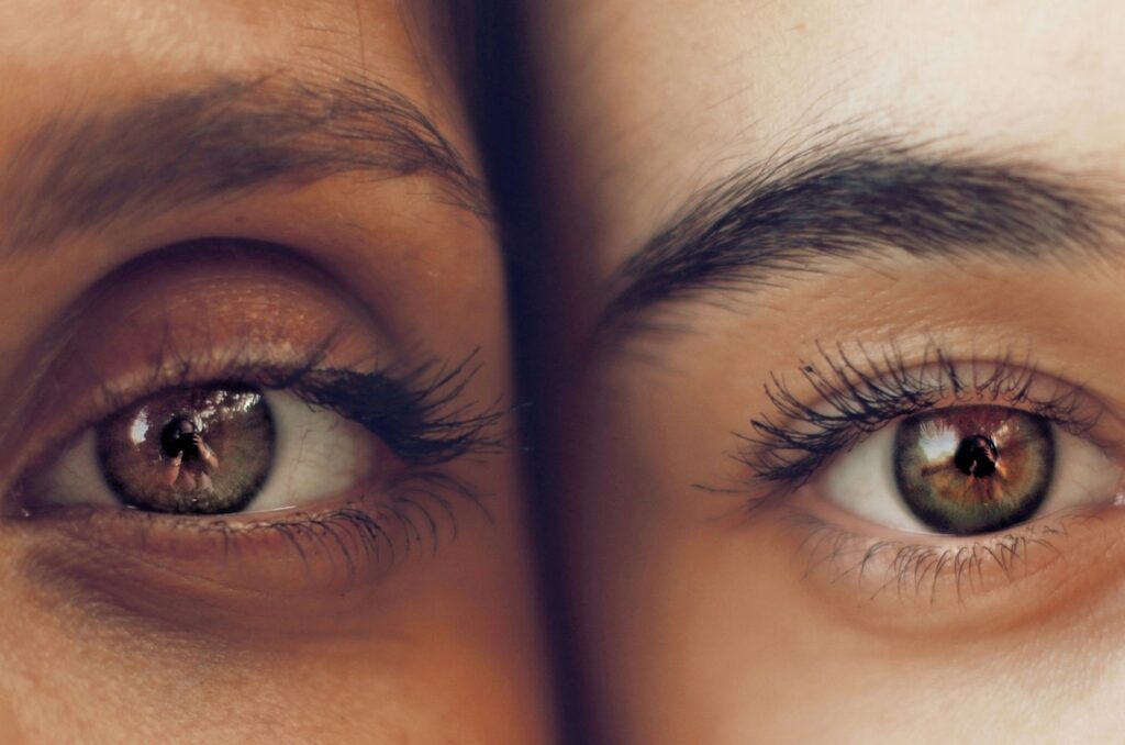 close up of eyes of two person