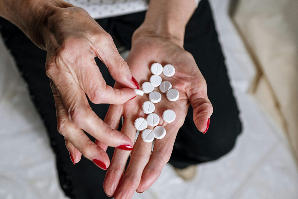 multiple tablets on the hand of a person