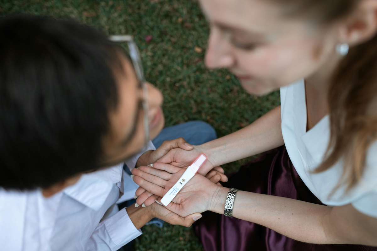 parent and a child holding hands and talking