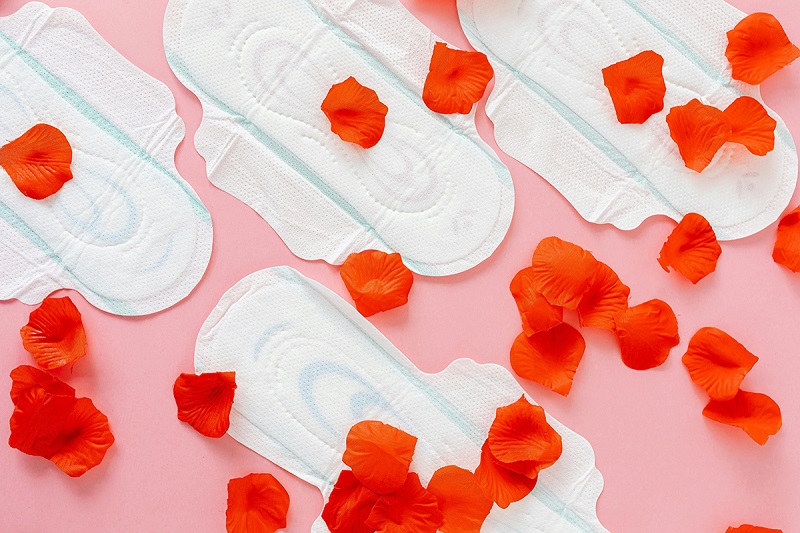 sanitary pads with some flower petals spread on top of them