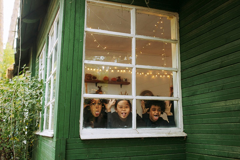 Kids watching through the window