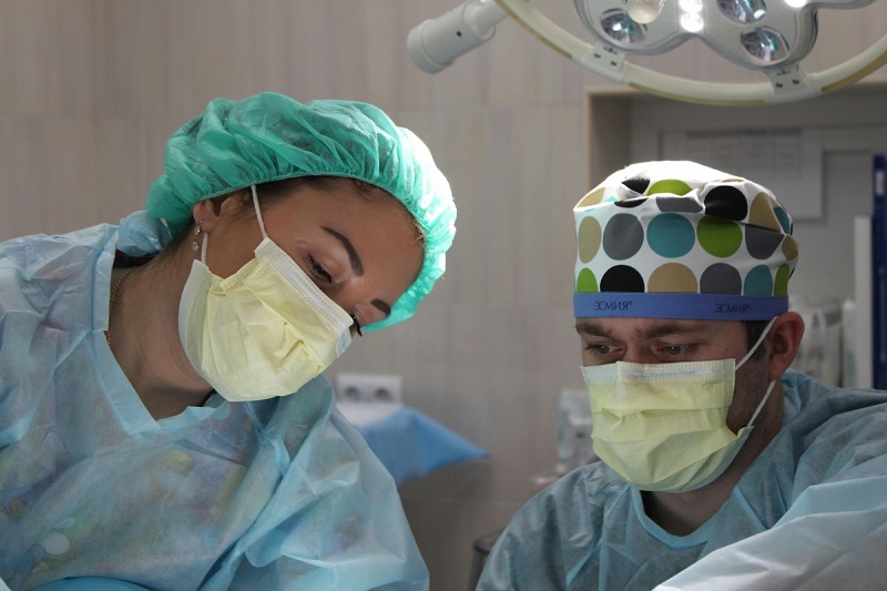 two doctors performing surgery in the operation theater