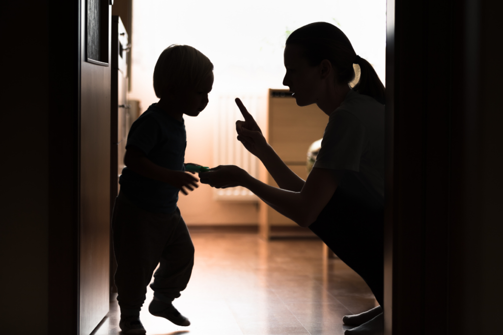 Parent disciplining her child.