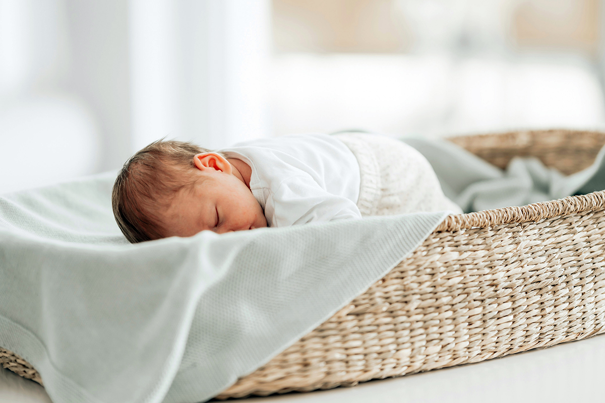 baby sleeping in a cot