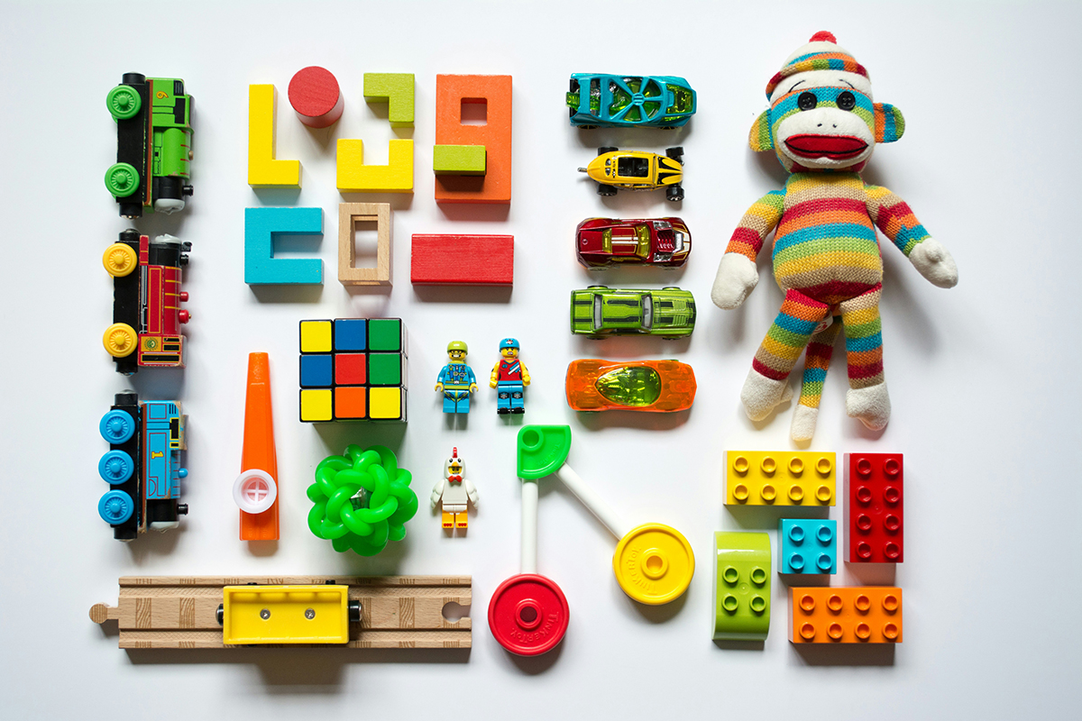 wooden toys placed on a white background