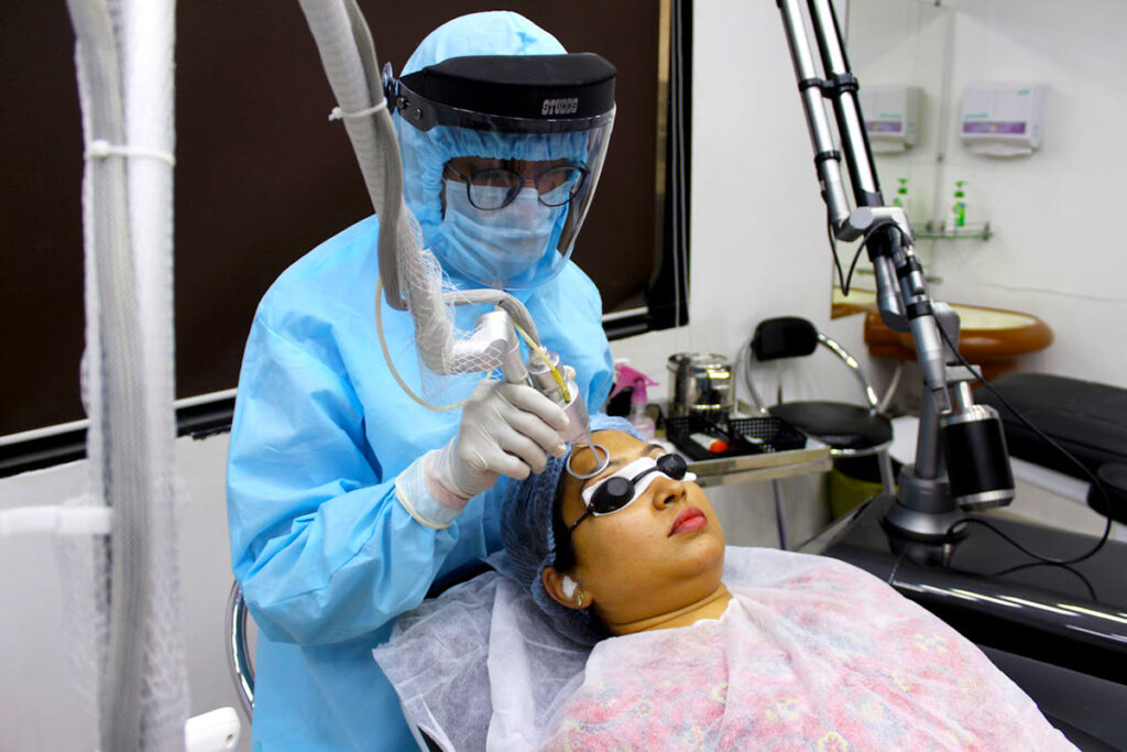 doctor doing acne treatment of a patient