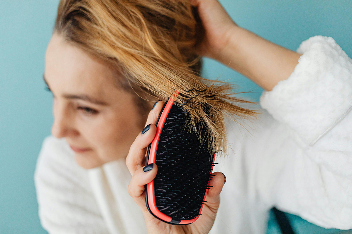 an adult combing the hairs