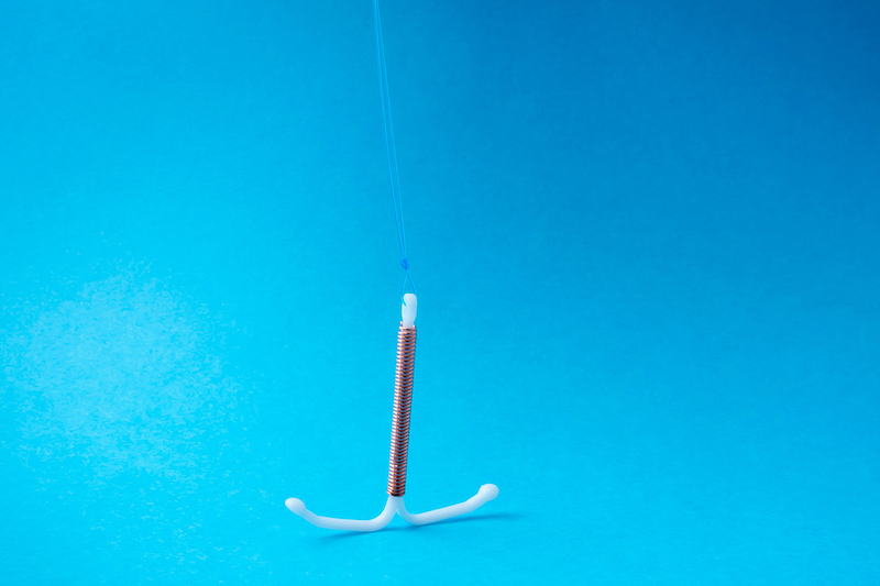 IUD in blue background