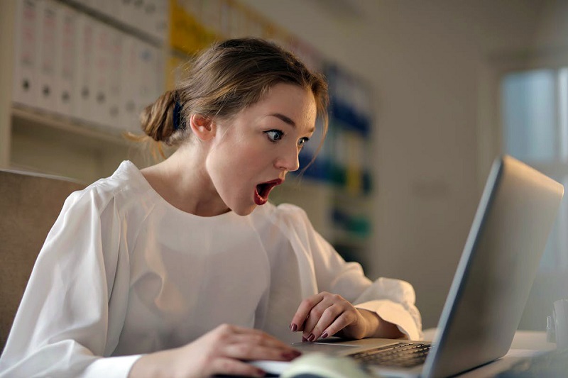 an adult using a laptop and doing a research