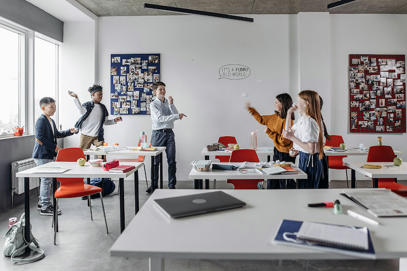 A classroom with kids playing