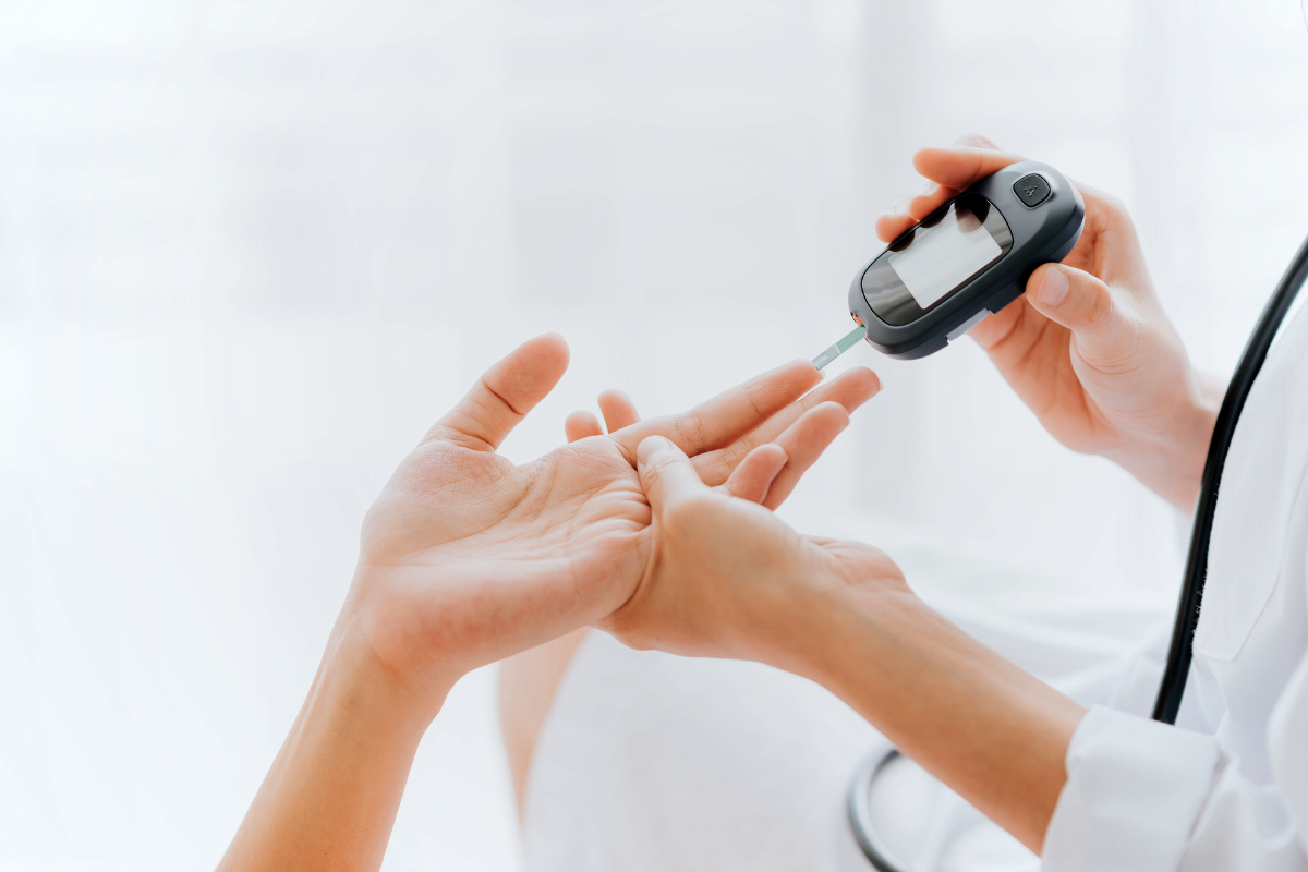 A doctor checking the glucose levels using glucometer