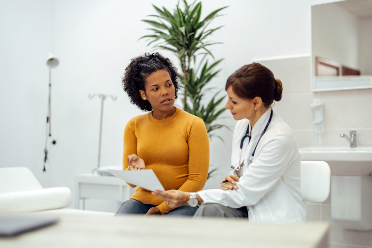 A doctor and a patient discussing the reports