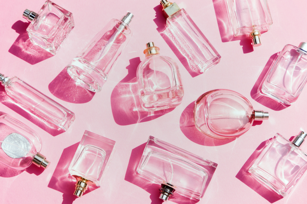 Few perfume bottles in a pink background