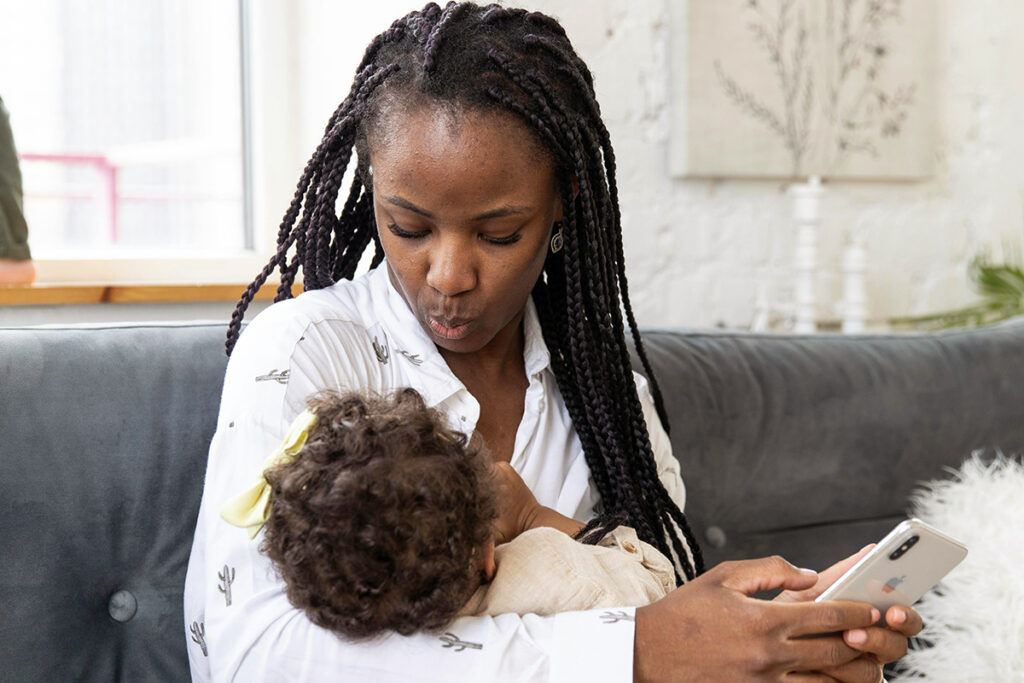 A parent breastfeeding a baby