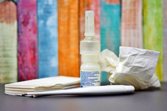 A saline spray and tissues in a colorful background