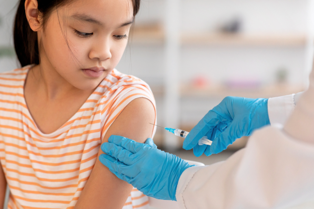 A kid getting a vaccine shot