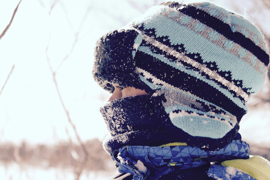 A kid in woolen clothing