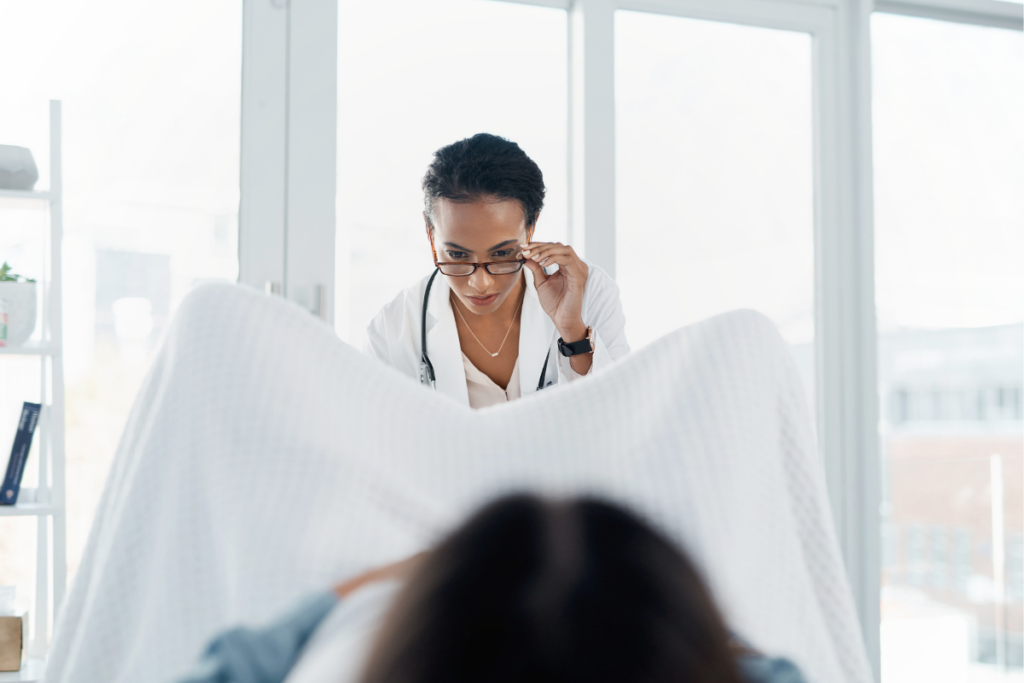 A doctor taking a look at a patient.