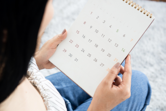 A person looking at the calendar