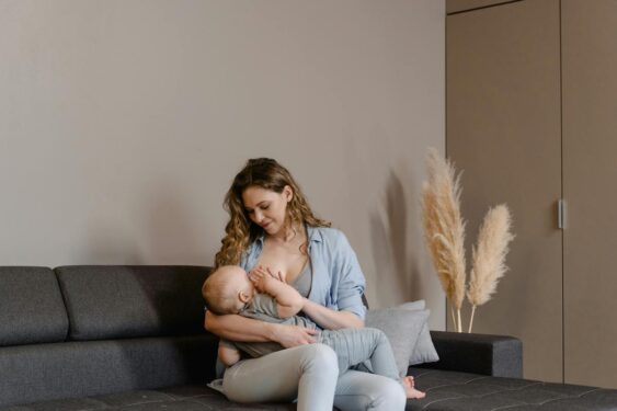 A parent breastfeeding her baby